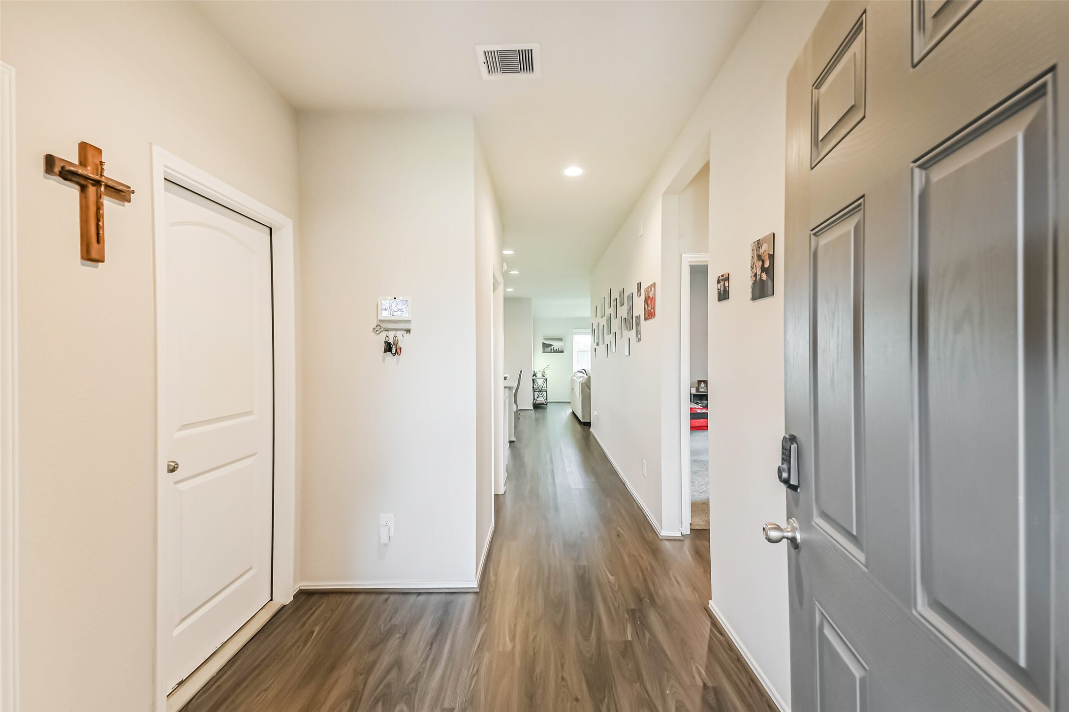 20342 Green Mountain Drive New Caney, TX 77357 - Photo 4 of 30 a view of a hallway with wooden floor and staircase