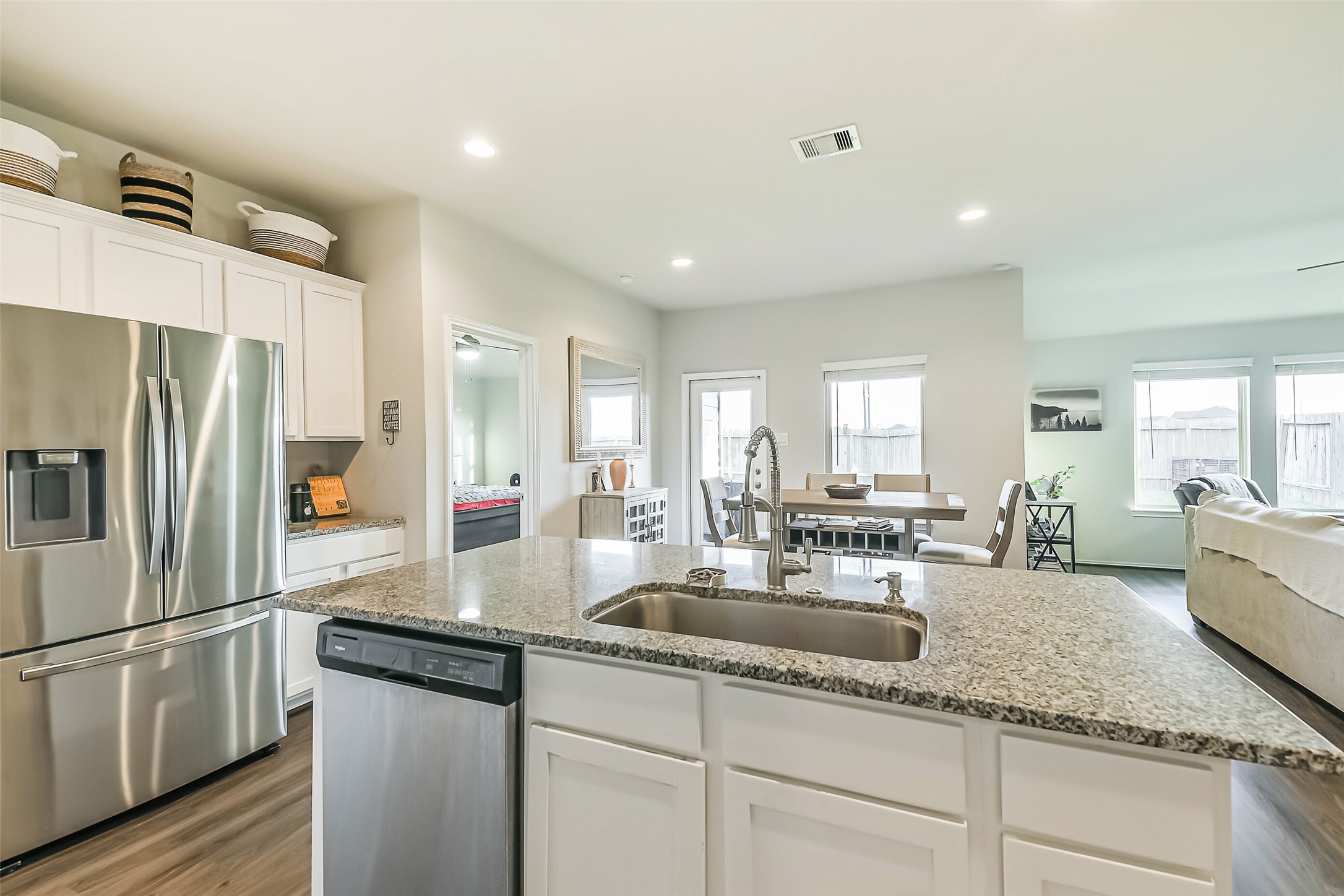 20342 Green Mountain Drive New Caney, TX 77357 - Photo 7 of 30 a kitchen with granite countertop a sink and refrigerator