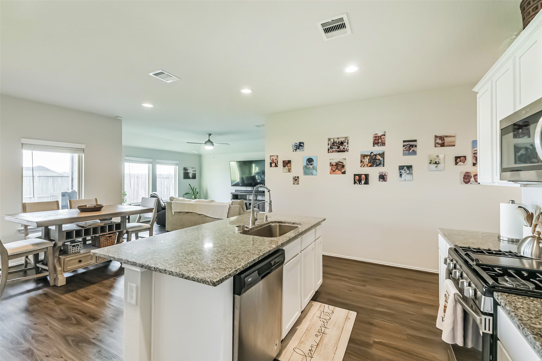 20342 Green Mountain Drive New Caney, TX 77357 - Photo 8 of 30 a kitchen with granite countertop a sink and cabinets