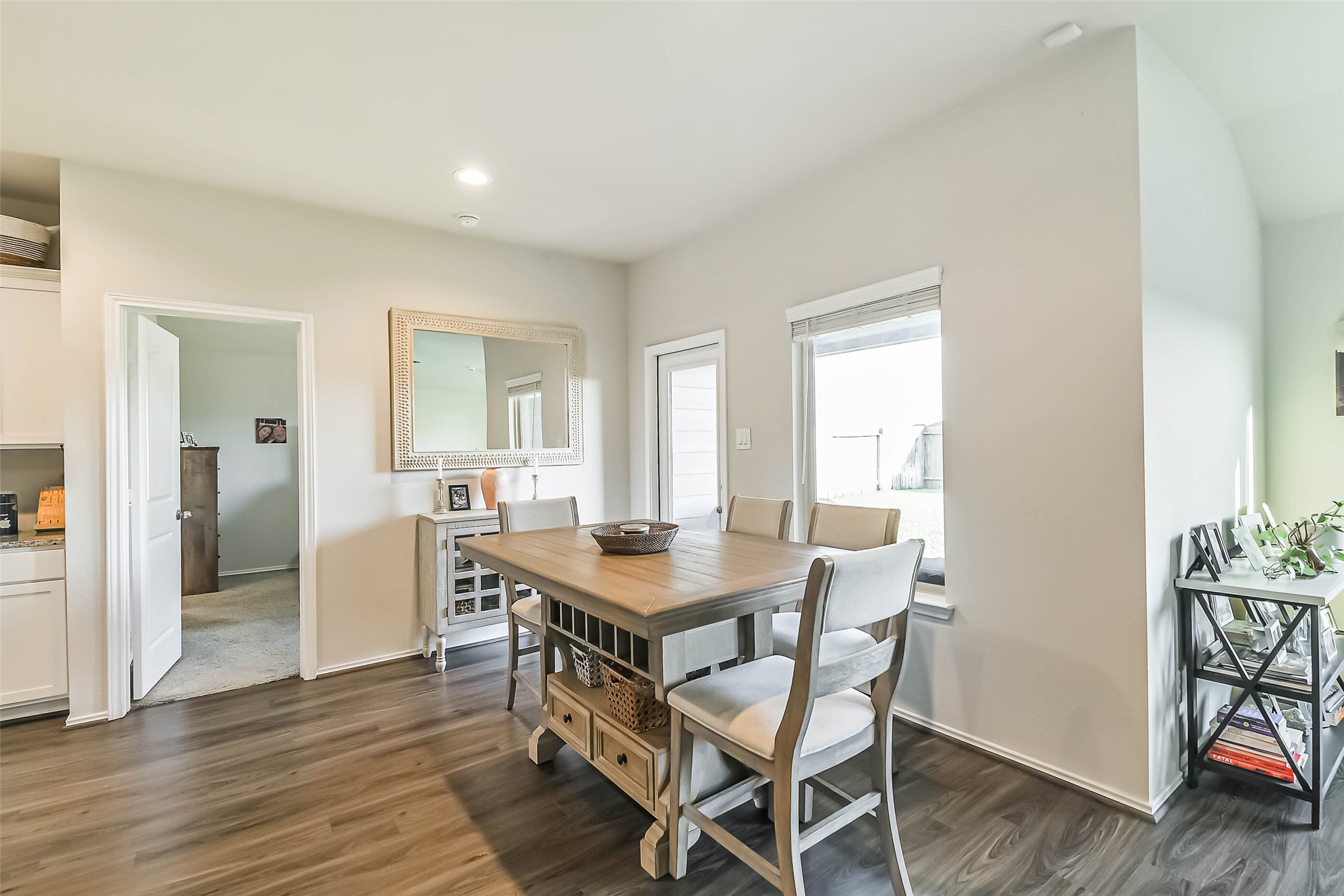 20342 Green Mountain Drive New Caney, TX 77357 - Photo 10 of 30 a view of a dining room with furniture and wooden floor