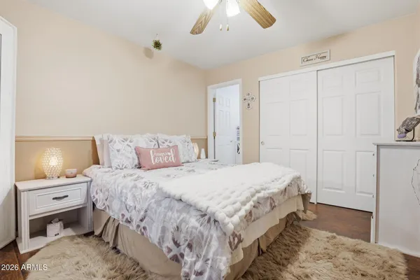 a bedroom with a bed and a tv
