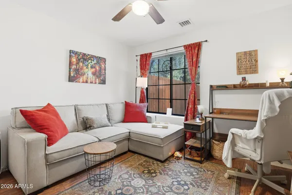 a living room with furniture and a window
