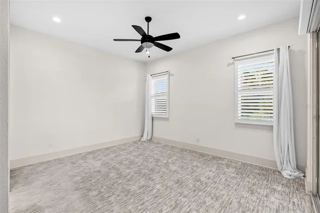 a view of room with ceiling fan