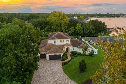 a view of a house with a yard and a large pool