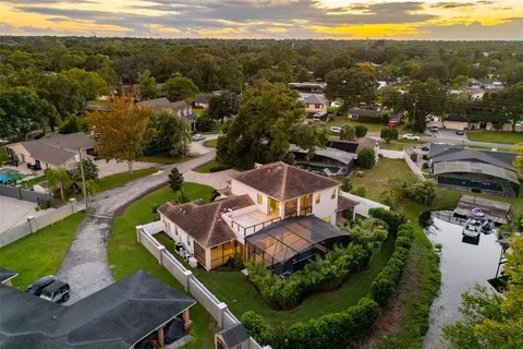 an aerial view of residential houses with outdoor space