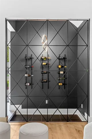 a room with a chandelier and white walls