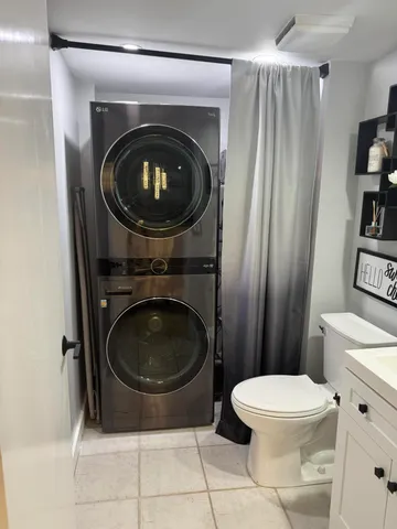 a bathroom with a toilet and a sink