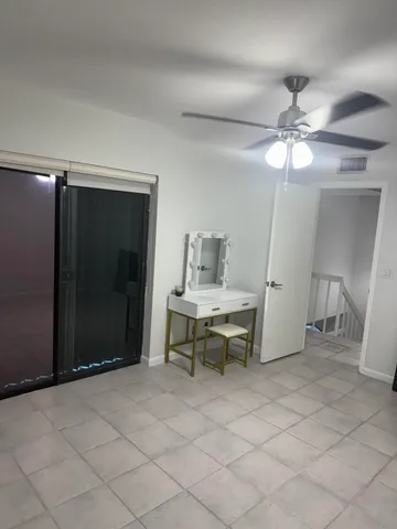 a view of work space with a table and chairs