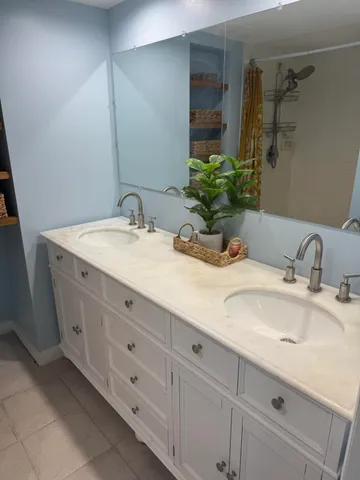 a white toilet sitting next to a bath tub and shower