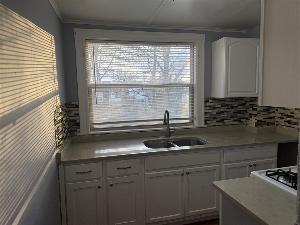 5-7 Stevens Street, Unit 1 Lawrence, MA 01843 - Photo 6 of 6 a kitchen with a sink and a window