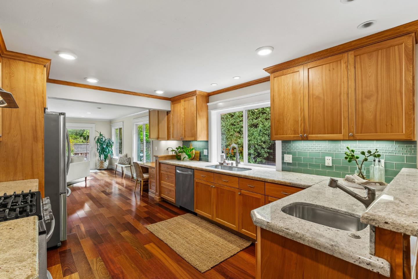 555 Risso Court Santa Cruz, CA 95062 - Photo 16 of 61 a kitchen with granite countertop sink stove and cabinets