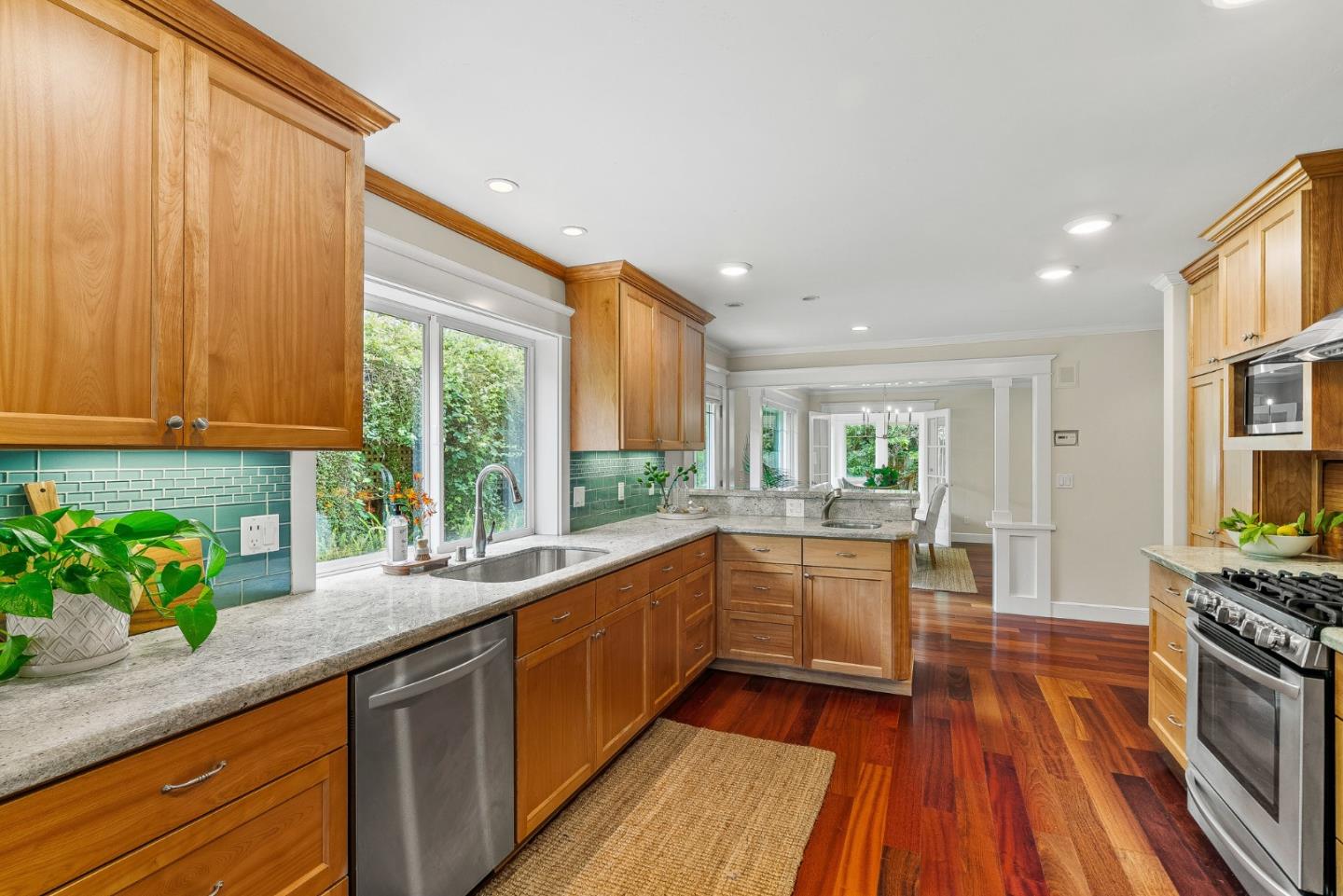 555 Risso Court Santa Cruz, CA 95062 - Photo 19 of 61 a large kitchen with granite countertop a large window and white appliances