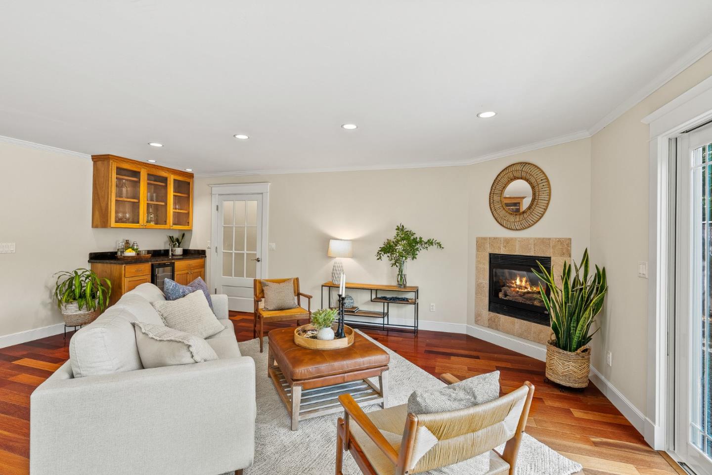 555 Risso Court Santa Cruz, CA 95062 - Photo 22 of 61 a living room with furniture a fireplace and a potted plant