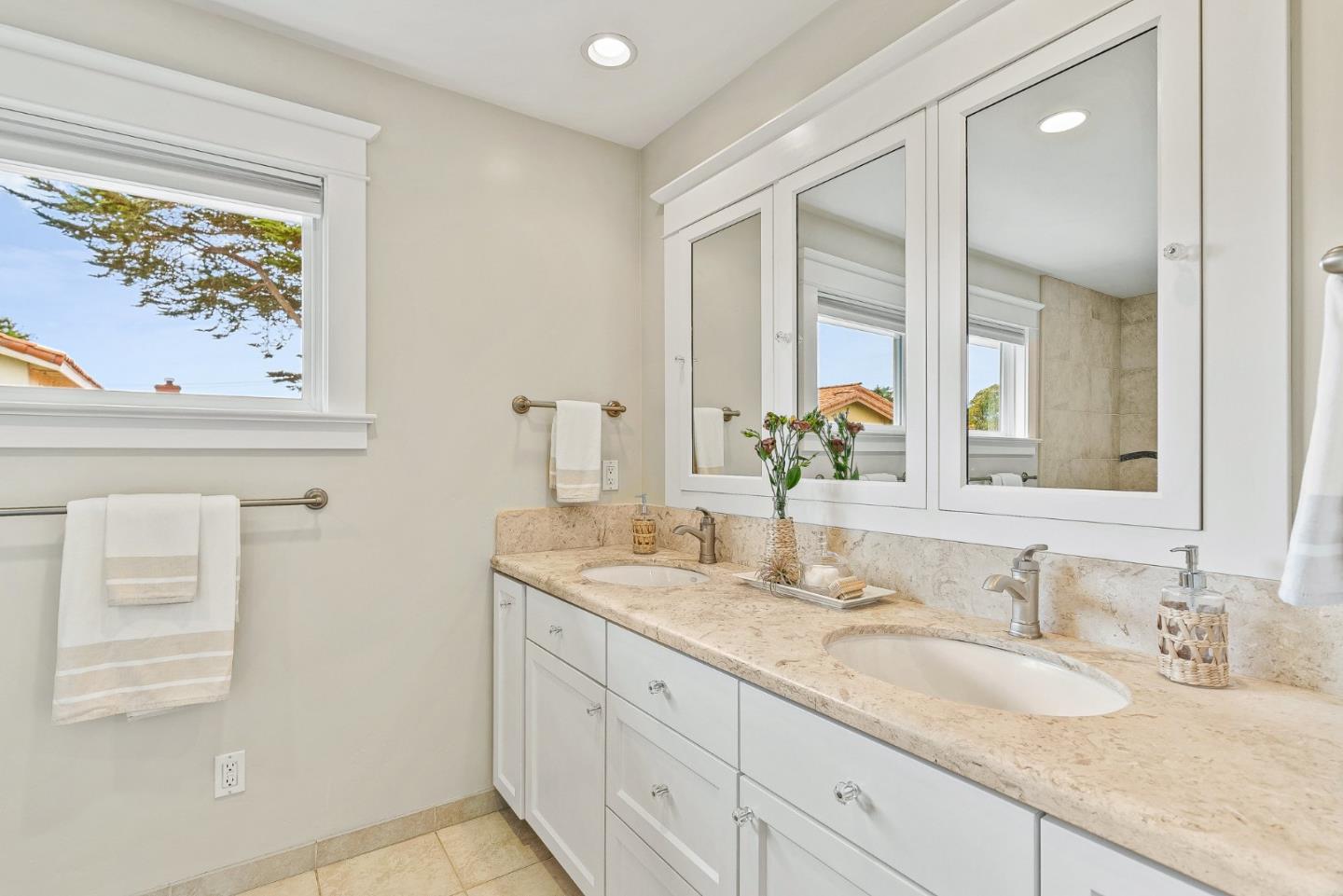 555 Risso Court Santa Cruz, CA 95062 - Photo 38 of 61 a bathroom with a granite countertop sink and a mirror