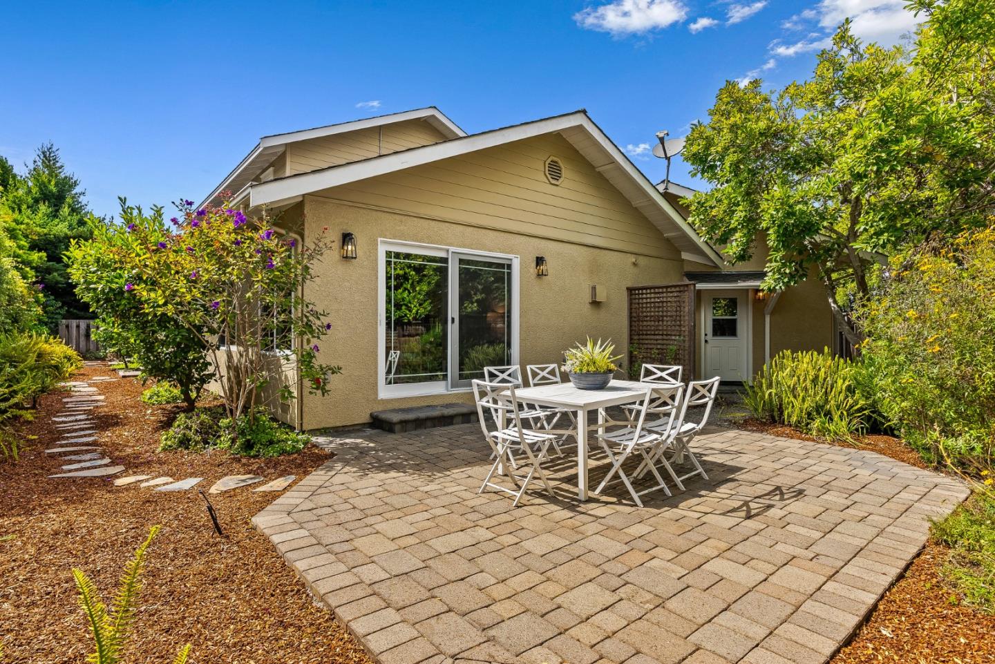 555 Risso Court Santa Cruz, CA 95062 - Photo 47 of 61 a view of a patio with table and chairs and potted plants