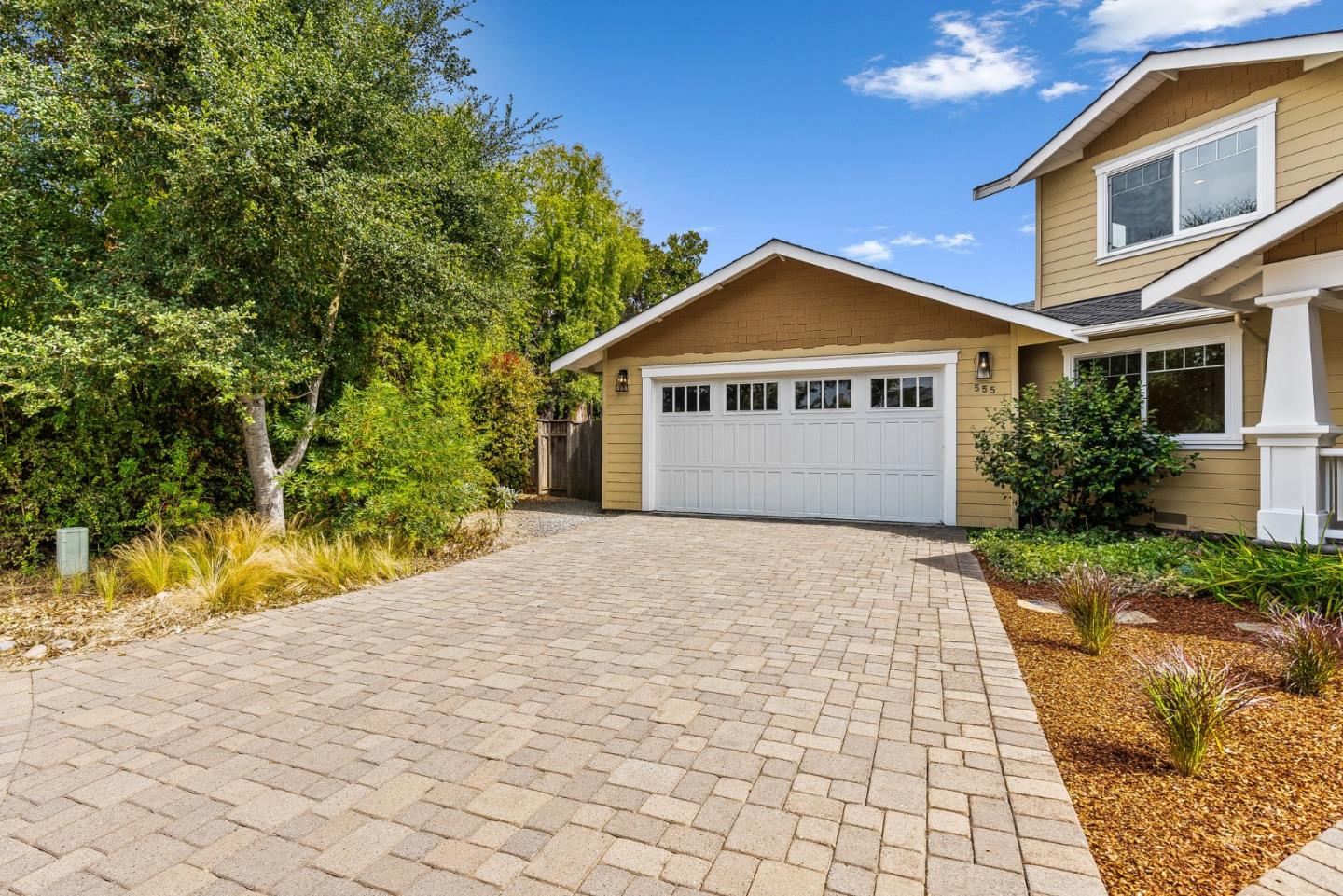 555 Risso Court Santa Cruz, CA 95062 - Photo 56 of 61 a front view of a house with a yard and garage