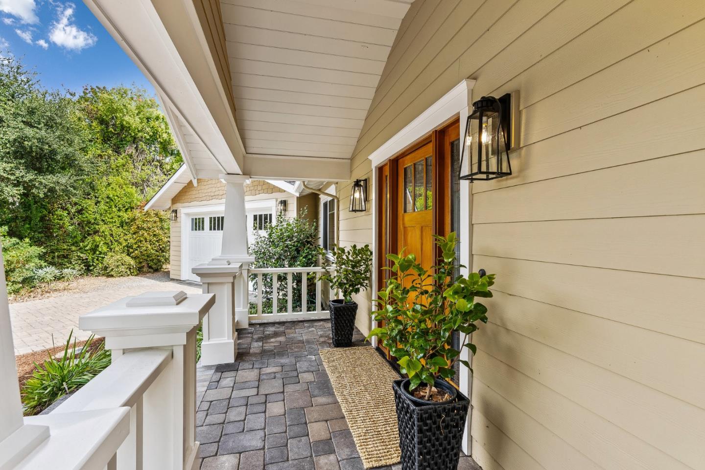 555 Risso Court Santa Cruz, CA 95062 - Photo 58 of 61 a porch with a table and chairs and potted plants