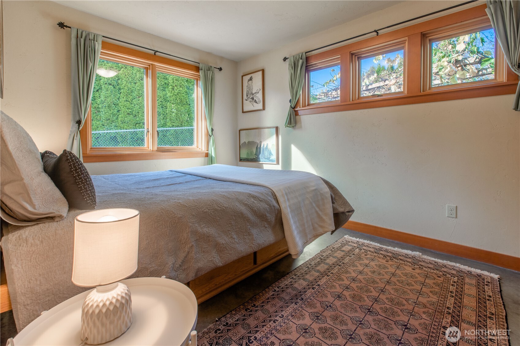 2516 Mill Avenue Bellingham, WA 98225 - Photo 15 of 36 a bedroom with a bed and wooden floor