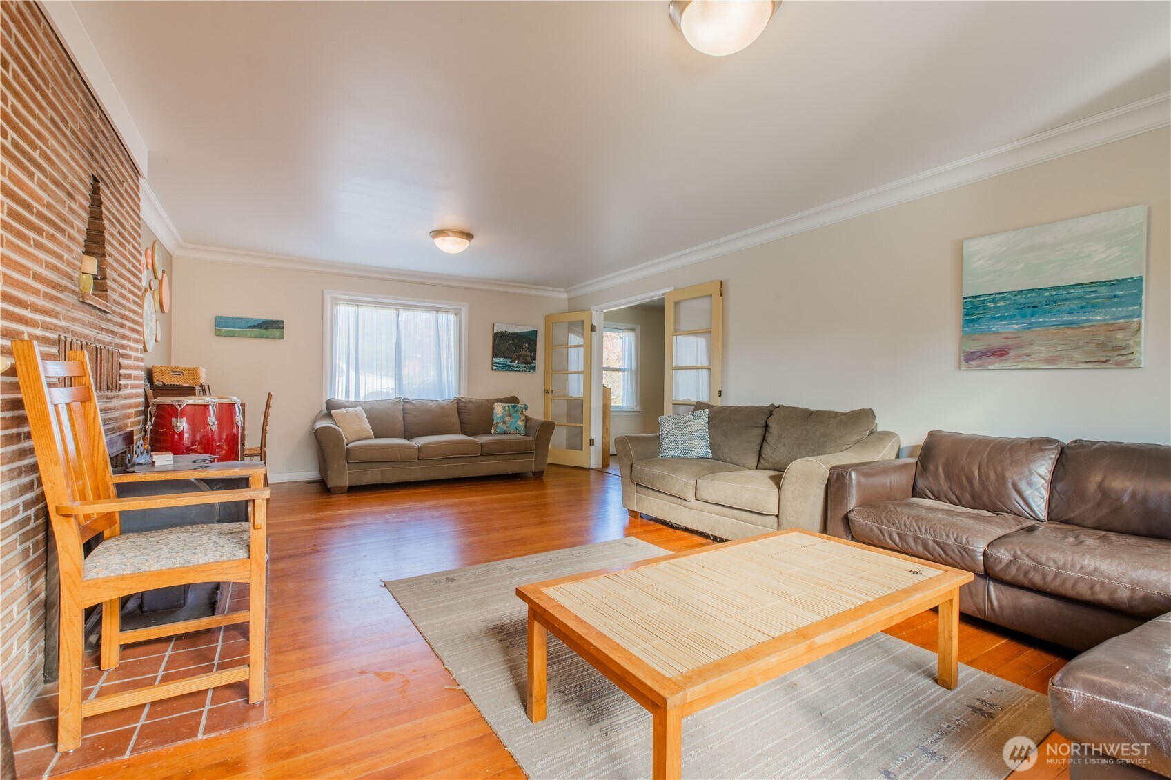 2516 Mill Avenue Bellingham, WA 98225 - Photo 32 of 36 a living room with furniture a rug and a window