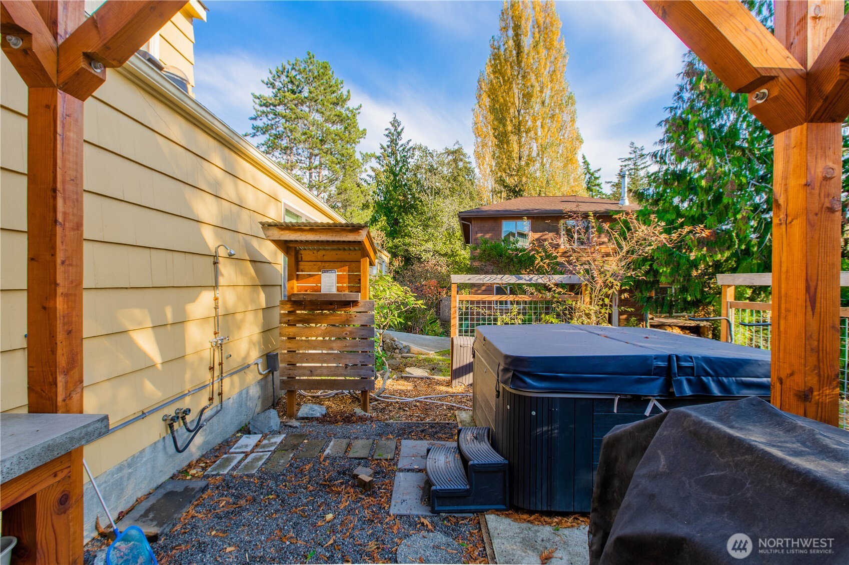 2516 Mill Avenue Bellingham, WA 98225 - Photo 33 of 36 a backyard of a house with barbeque oven table and chairs