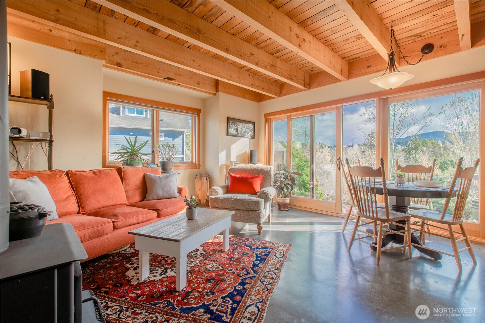 2516 Mill Avenue Bellingham, WA 98225 - Photo 5 of 36 a living room with furniture a table and chairs next to a window