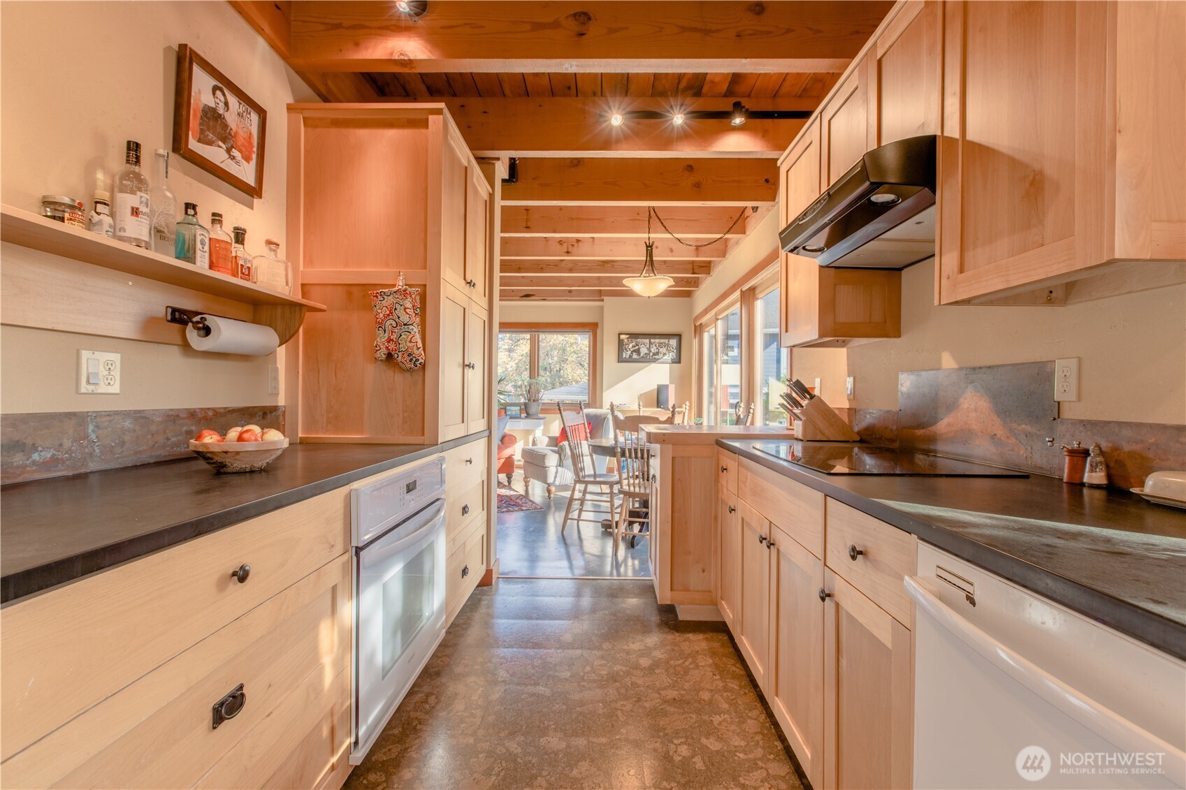 2516 Mill Avenue Bellingham, WA 98225 - Photo 7 of 36 a kitchen with stainless steel appliances granite countertop lots of counter top space and wooden floor