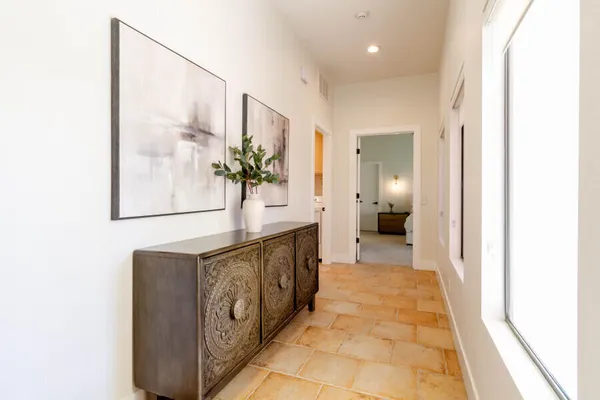 a bathroom with a granite countertop sink a mirror and a shower