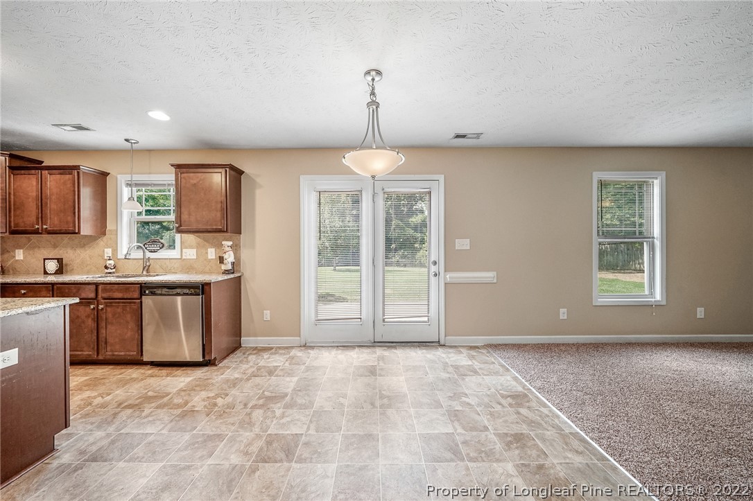 2673 Rockfish Road Raeford, NC 28376 - Photo 14 of 42 a view of kitchen with granite countertop cabinets and window
