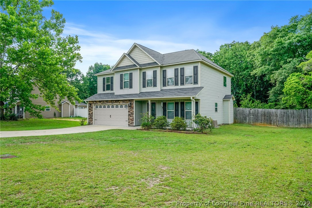 2673 Rockfish Road Raeford, NC 28376 - Photo 3 of 42 a view of a house with a yard and sitting area
