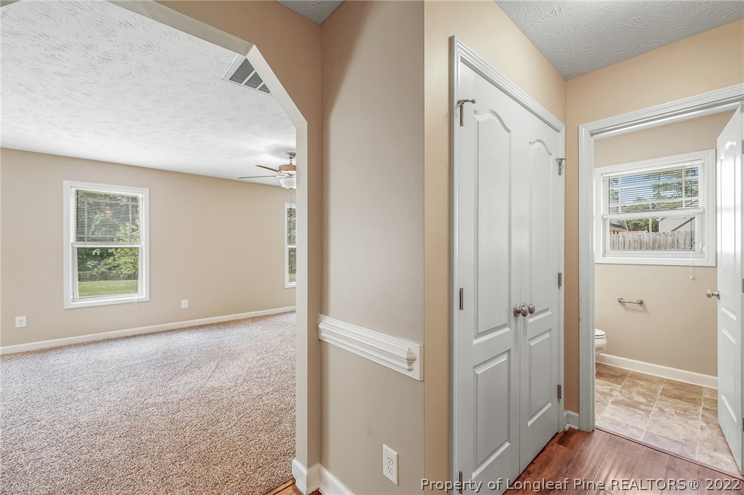 2673 Rockfish Road Raeford, NC 28376 - Photo 8 of 42 a view of an empty room with wooden floor and a window