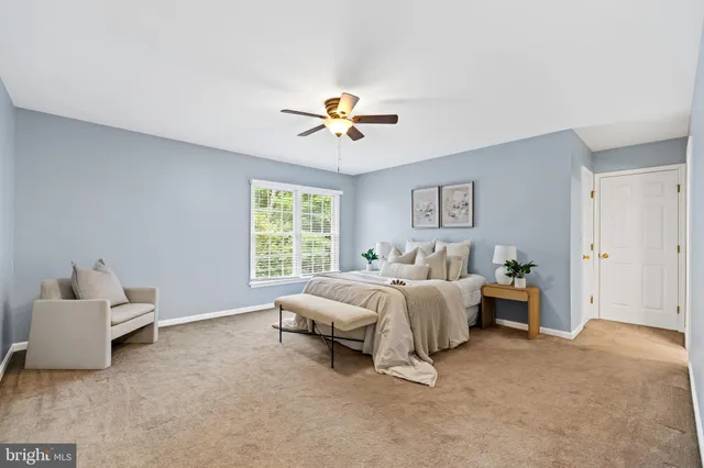 a bed room with a bed and a chandelier