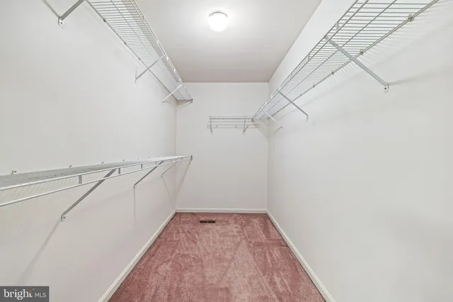 a view of a room with racks on the wall