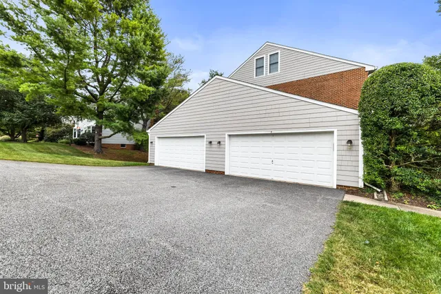 a view of a house with a yard and garage