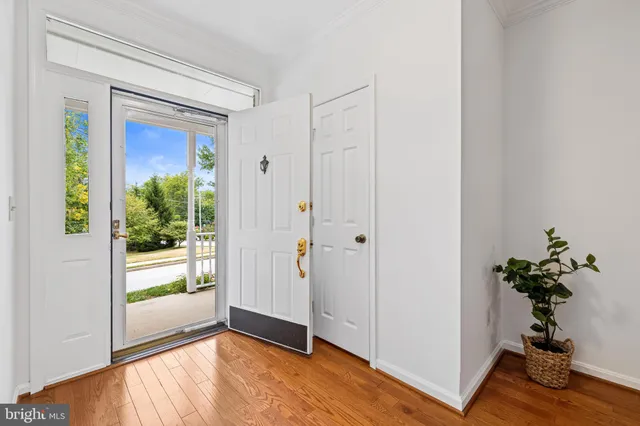 a view of an entryway with wooden floor