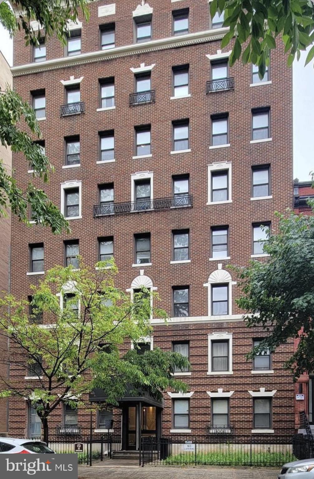 a front view of a building with garden