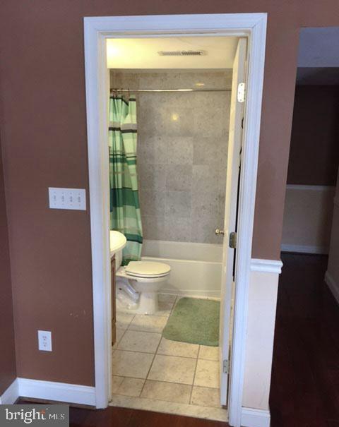 1125 12th Street Northwest, Unit 64 Washington, DC 20005 - Photo 12 of 42 a bathroom with a glass door shower