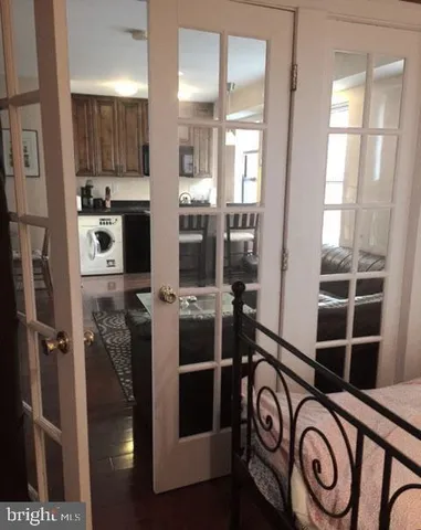 a view of washer and dryer with kitchen in the background