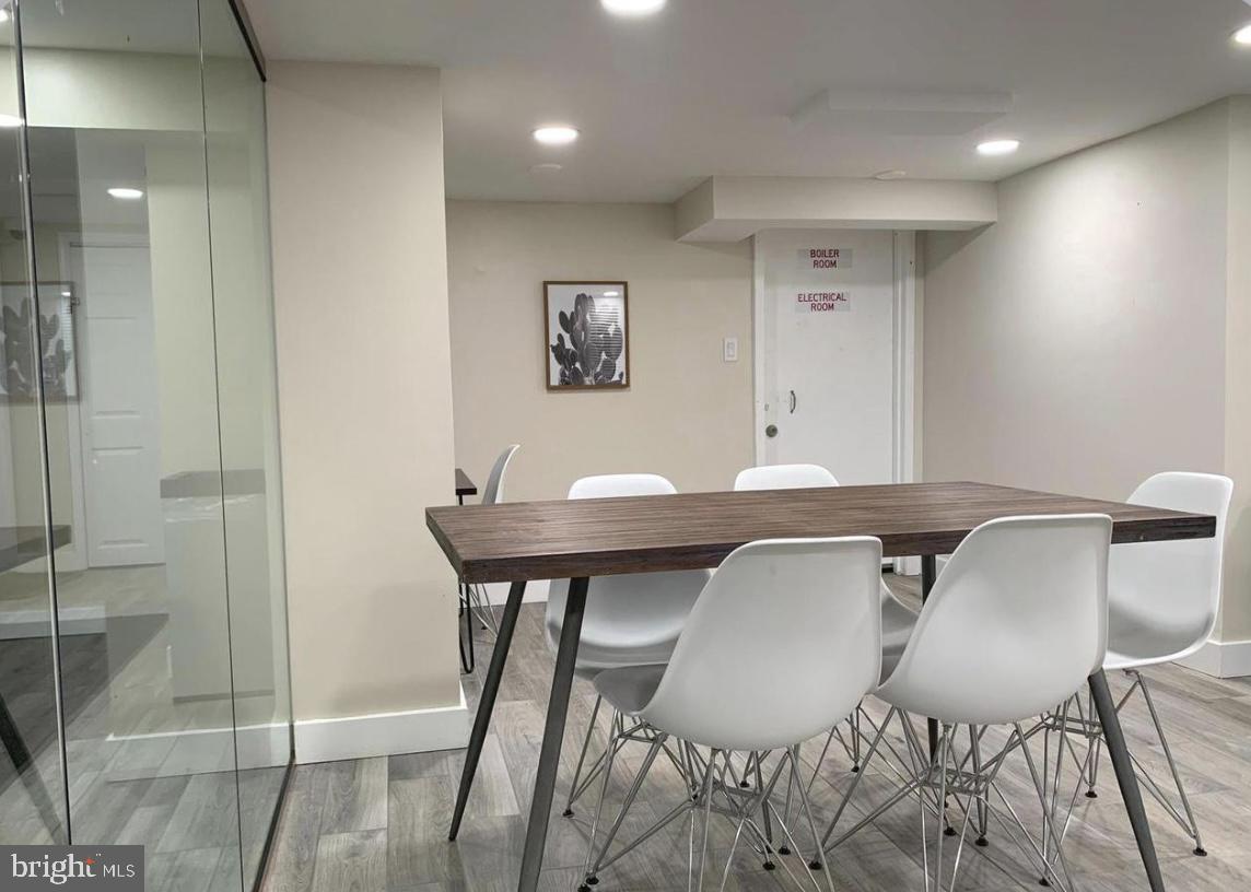 1125 12th Street Northwest, Unit 64 Washington, DC 20005 - Photo 34 of 42 a view of a dining room with furniture and wooden floor
