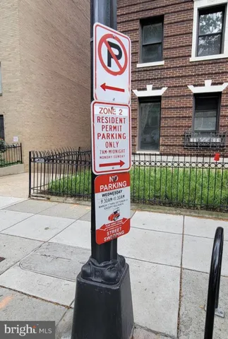 a front view of a building with retail shops