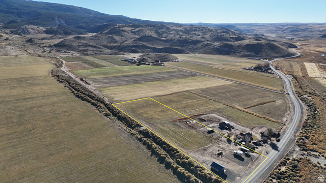 890 East Hatchery Road Bicknell, UT 84715 - Photo 3 of 48 Overview of rural landscape featuring rows of crops, property boundaries highlighted, and a mountainous background