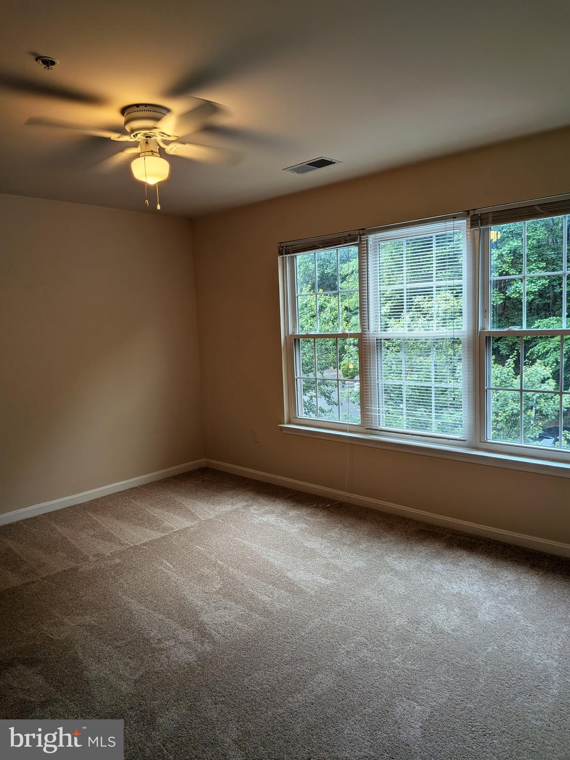 109 Timberbrook Lane, Unit 301 Gaithersburg, MD 20878 - Photo 11 of 22 an empty room with a window