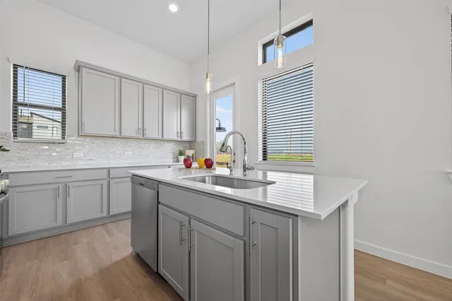 a kitchen with sink cabinets and window
