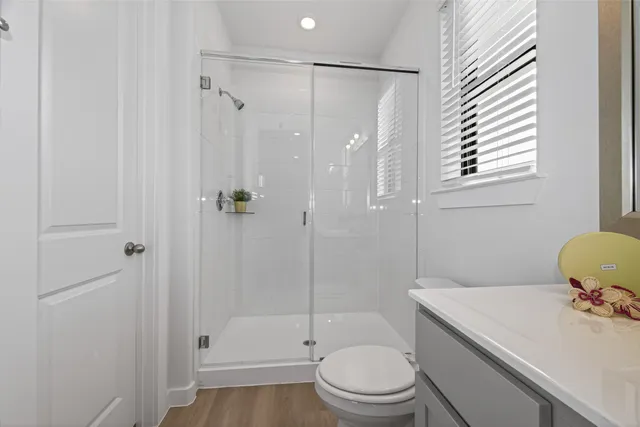 a bathroom with a sink toilet and shower
