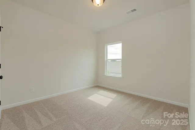 a bathroom with a sink toilet vanity and shower