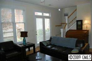 3444 Stettler View Road, Unit 225 Charlotte, NC 28210 - Photo 3 of 8 a living room with furniture and a flat screen tv