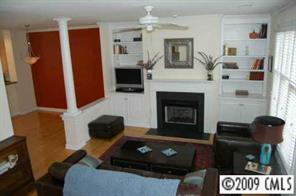 3444 Stettler View Road, Unit 225 Charlotte, NC 28210 - Photo 5 of 8 a living room with furniture and a fireplace