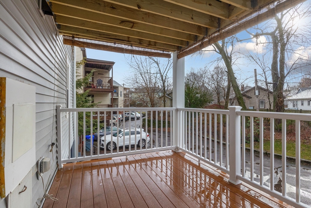 161 Florence Street, Unit 2 Boston, MA 02131 - Photo 13 of 14 a view of a balcony with wooden floor