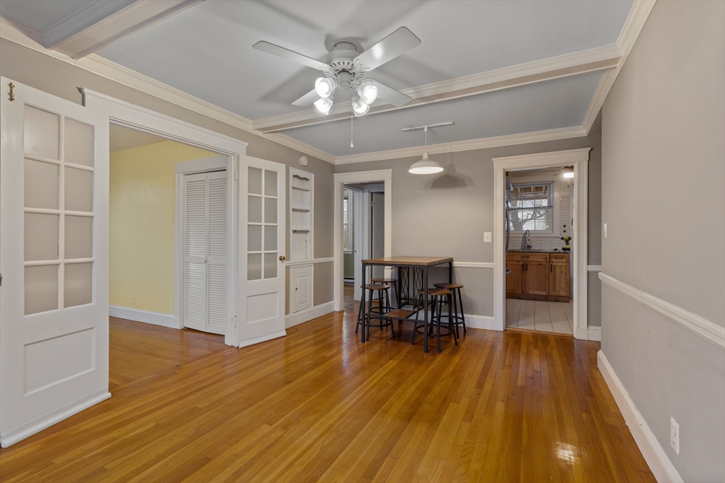 161 Florence Street, Unit 2 Boston, MA 02131 - Photo 5 of 14 a view of a livingroom with furniture and a chandelier