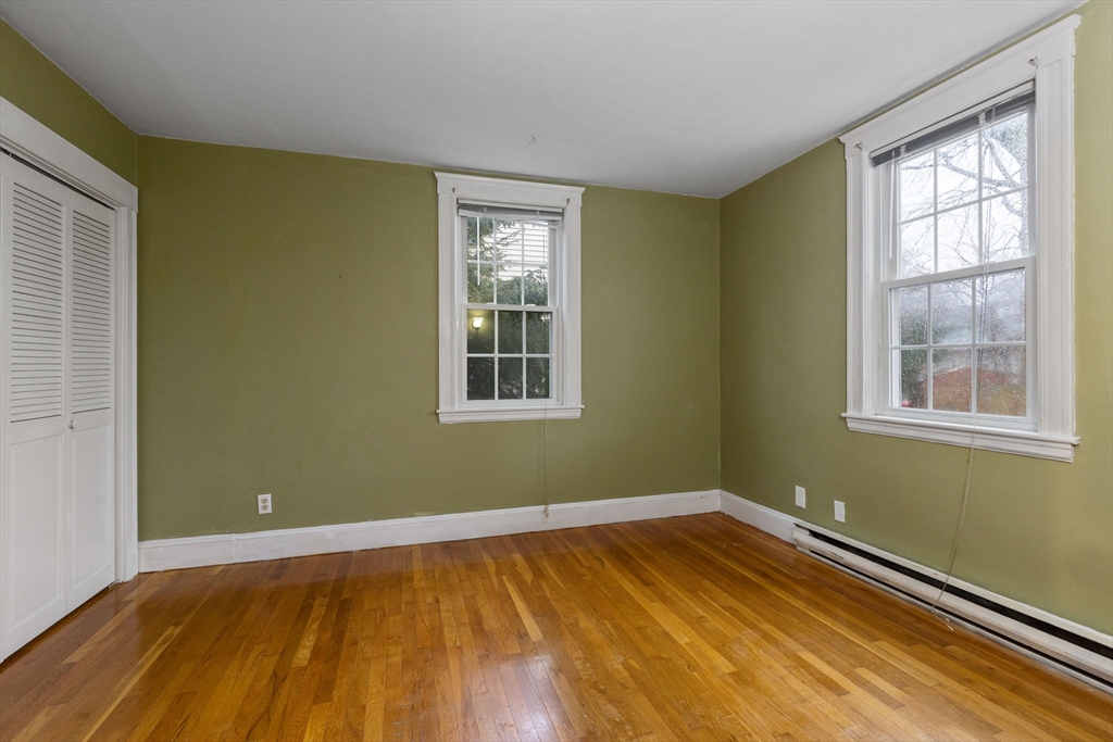 161 Florence Street, Unit 2 Boston, MA 02131 - Photo 10 of 14 a view of a room with wooden floor and a window