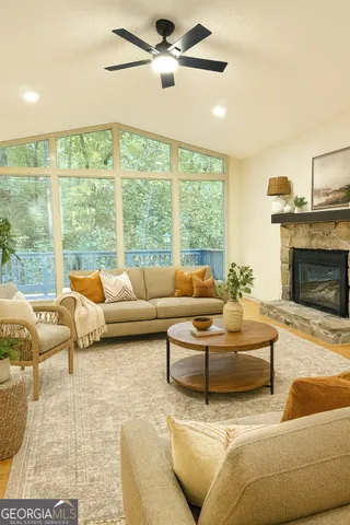 a living room with furniture and a fireplace